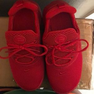 Girls red mesh Nike sneakers